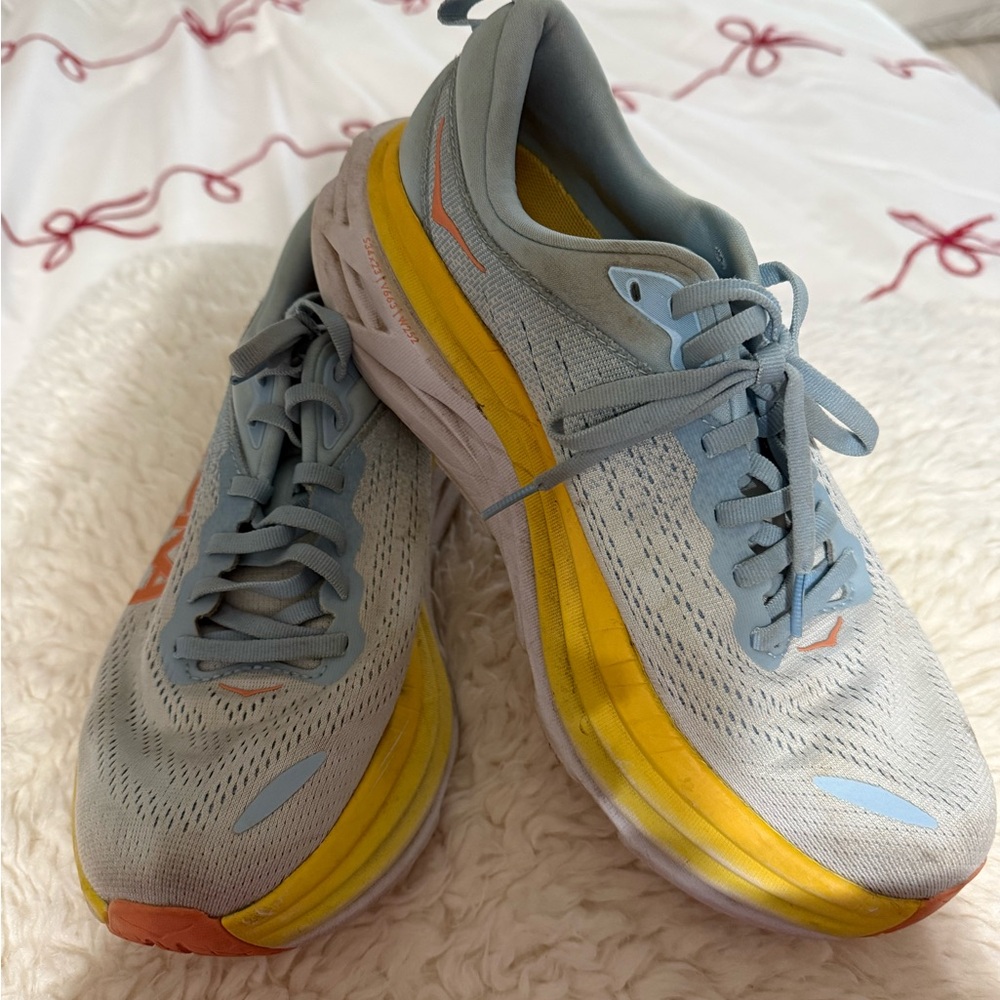 HOKA Light Blue Athletic Running Shoes with Yellow Accents